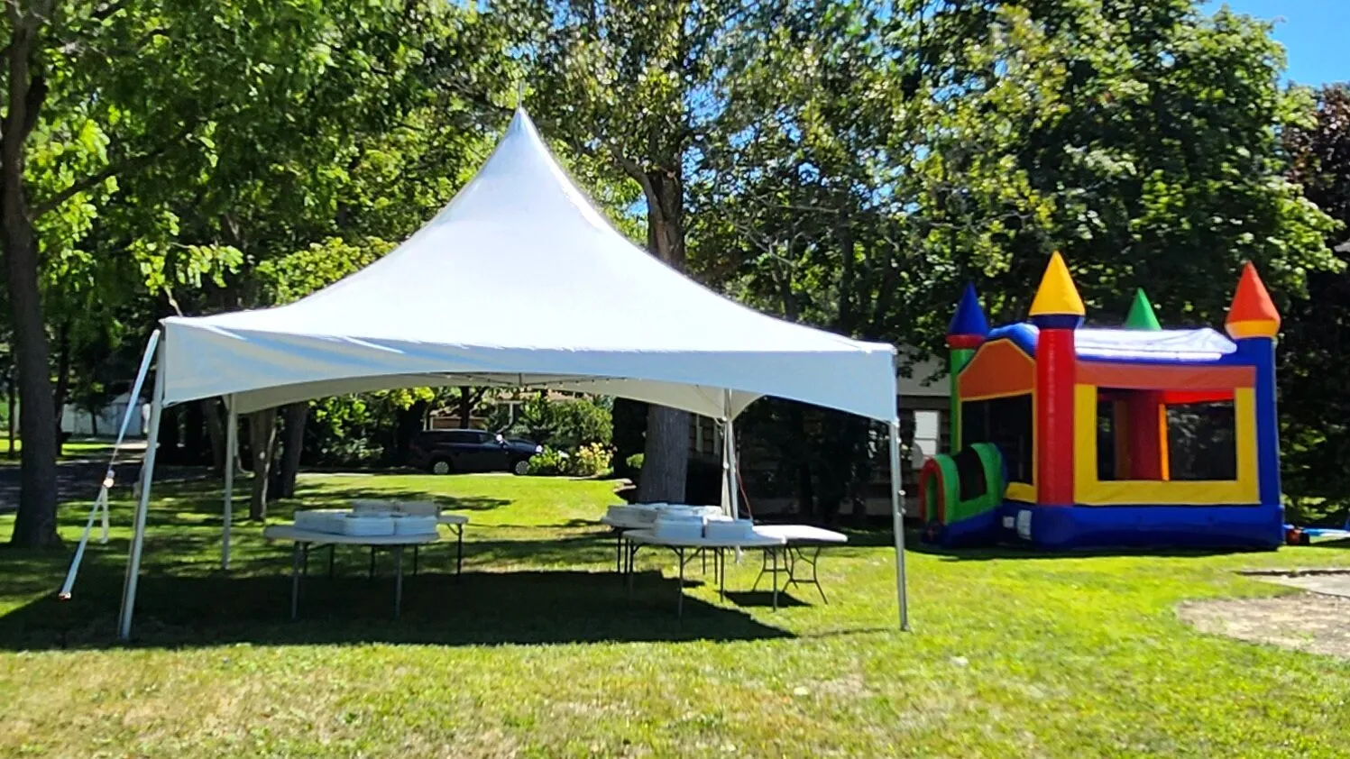 20x20 high peak party tent with bounce castle combo package seating 40 guests — Tent Pro LLC Long Island tent rentals