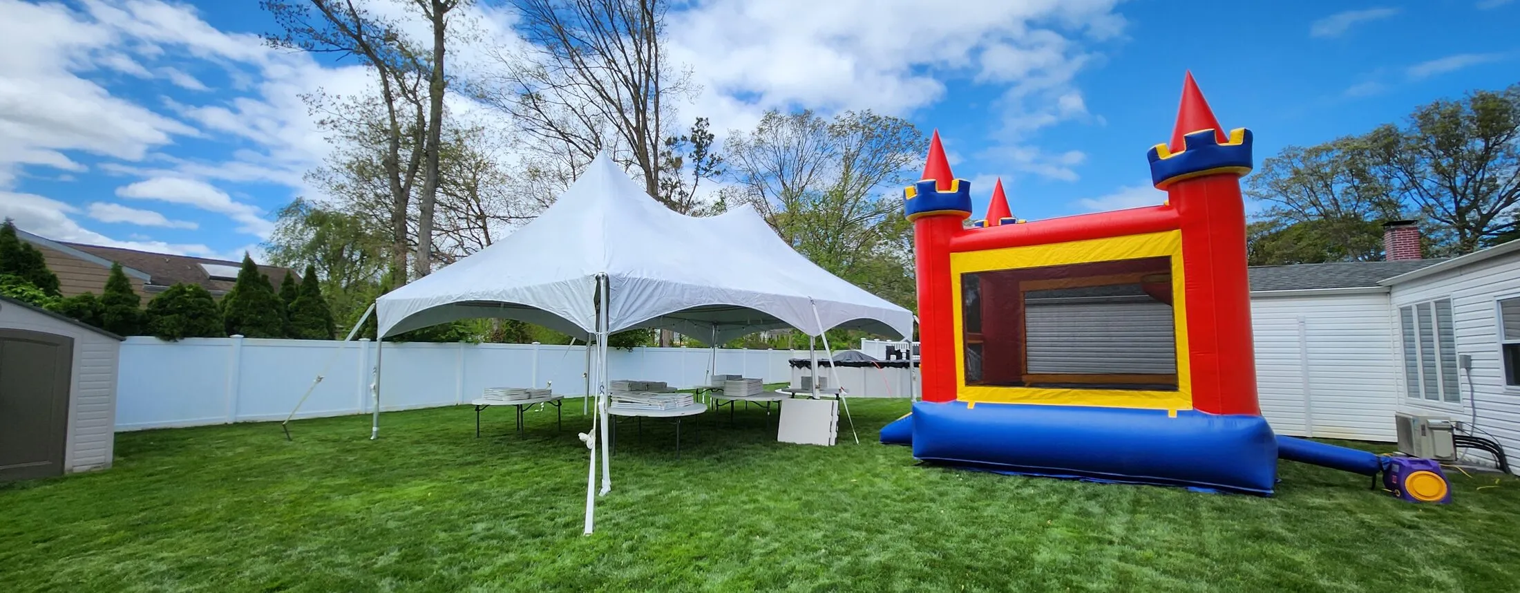 20x30 high peak party tent with bounce castle combo package seating 60 guests — Tent Pro LLC Long Island tent rentals