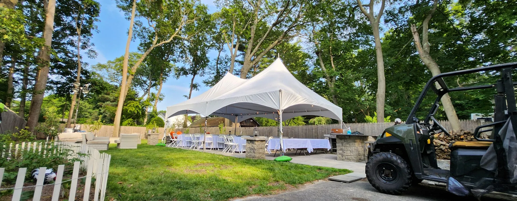 20x30 high peak party tent package with tables and chairs seating 60 guests, installed in St. James, NY — Tent Pro LLC Long Island tent rentals