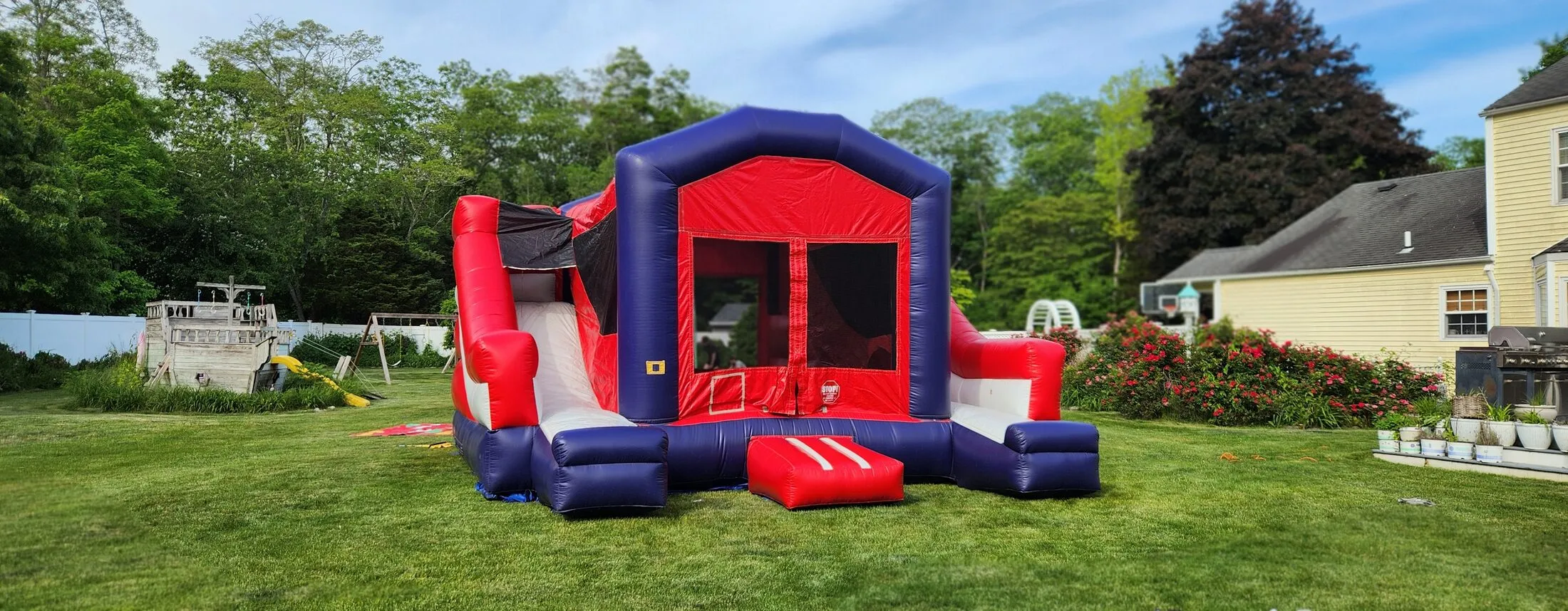Red white and blue bounce castle double slide combo rental Long Island
