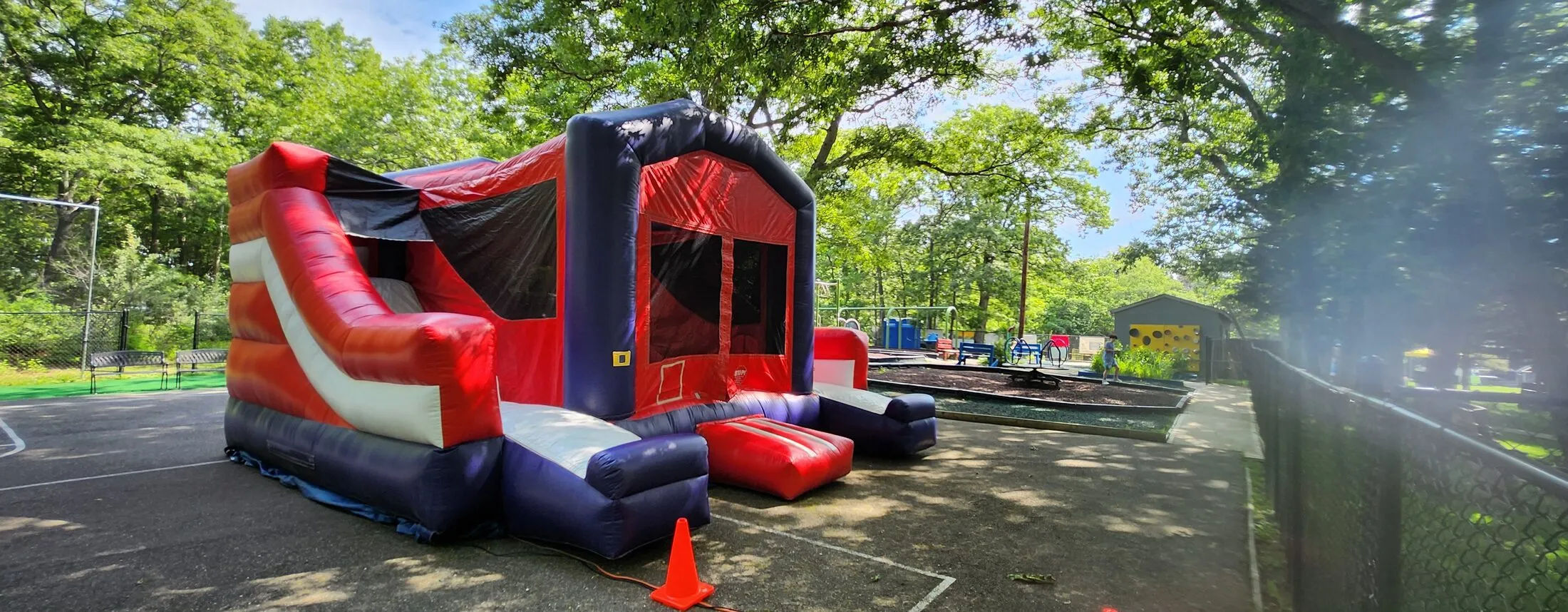 Red white and blue bounce castle double slide combo rental Long Island